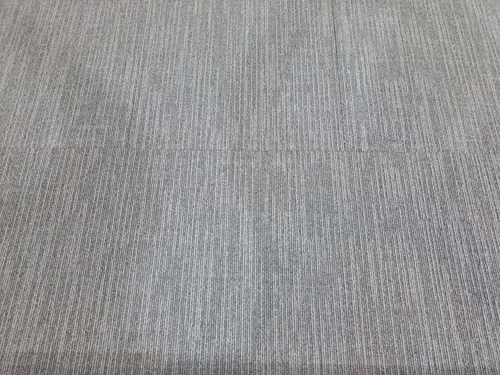 Top-down photograph showing the complete carpet-tile surface